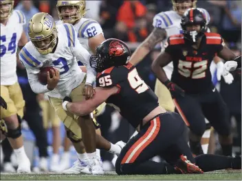  ?? AMANDA LOMAN — THE ASSOCIATED PRESS ?? Oregon State’s Joe Golden sacks UCLA quarterbac­k Dante Moore during the first half of Saturday’s game.