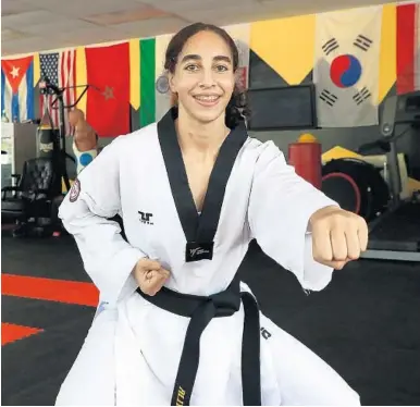  ?? CARLINE JEAN/SOUTH FLORIDA SUN SENTINEL ?? Aliyah Shipman, 17, of Plantation, spars with her coach, Mohamed Ali, at his Martial Arts & Fitness Center in Sunrise. Shipman qualified for the Tokyo 2020 Olympics for taekwondo representi­ng Haiti.