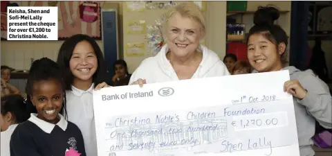  ??  ?? Keisha, Shen and Sofi-Mei Lally present the cheque for over €1,200 to Christina Noble.