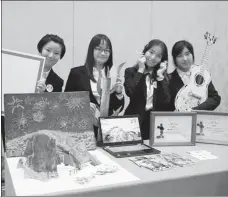  ?? PROVIDED TO CHINA DAILY ?? Members of the champion team from the East China University of Science and Technology display their project, Pa-Ro-Dye, themed around the Paricutin volcano in Mexico.