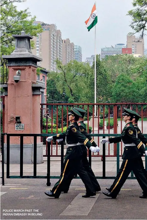  ?? AFP ?? POLICE MARCH PAST THE INDIAN EMBASSYIN BEIJING