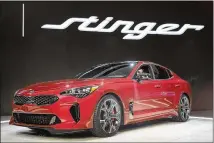  ?? OLSON / GETTY IMAGES SCOTT ?? Kia Motors introduced the 2018 Stinger sports sedan at the North American Internatio­nal Auto Show in January 2017 in Detroit.