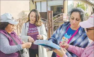  ?? Gabriella Angotti-Jones Los Angeles Times ?? L.A. CITY COUNCIL hopeful Cyndi Otteson, center left, canvasses in Boyle Heights in January. Otteson and other candidates are trying to build the type of grass-roots momentum that’s propelled Sen. Bernie Sanders.