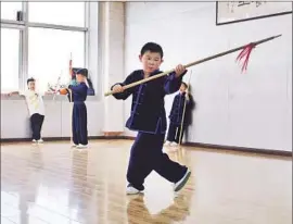  ?? Stuart Leavenwort­h McClatchy / TNS ?? I N BEIJING, a student practices at one of Zhang Xiaohang’s studios. After a series of knife attacks at Chinese schools, Zhang developed training for children.