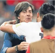  ??  ?? Germany head coach Joachim Low celebrates with players after winning the Confederat­ions Cup.