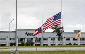  ?? DYLAN WILSON/THE NEW YORK TIMES ?? A flag flies at half-staff Friday at Daniel Defense’s headquarte­rs in Black Creek, Ga. After one of its military-style rifles was used in the Texas school shooting, the gunmaker issued a statement sending “thoughts and prayers.”