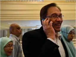  ?? MANAN VATSYAYANA/AFP/GETTY IMAGES ?? Opposition leader Anwar Ibrahim’s conviction on sodomy charges, a case widely viewed as a political attack, was upheld in February.