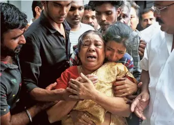  ?? R.K. NITHIN ?? Tragic: Manoj Unni’s mother and sister weep inconsolab­ly on seeing his body at a private hospital in the city on Monday.