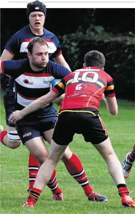  ??  ?? of two Stewart’s-Melville players during Saturday’s Scottish Cup victory