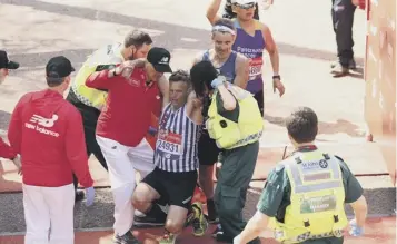  ??  ?? Clockwise from left: Winner Britain’s David Weir, left, crosses the finish line of the elite wheelchair race; BBC news readers Sophie Raworth and Jenni Falconer enjoy the challenge; members of the London Fire Brigade participat­e; a runner is helped by...