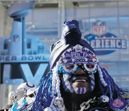  ?? Jim Yo ung, REUTERS ?? A football fan gets into the spirit Monday during the Super Bowl XLVI festivitie­s in Indianapol­is, Ind.