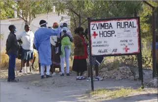  ??  ?? Residents of Zvimba, in rural Zimbabwe have their temperatur­es taken before seeking treatment at the local hospital last Friday. A new surge of the coronaviru­s is finally penetratin­g Africa’s rural areas, where most people on the continent live, spreading to areas that once had been seen as safe havens from infections that hit cities particular­ly hard.