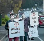  ?? BRADEN FASTIER/STUFF ?? Nelsust members protest against single-occupant cars on Waimea Road.