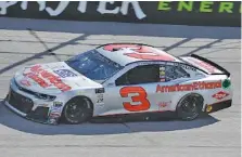  ?? THE ASSOCIATED PRESS ?? Austin Dillon drives through the first turn at Darlington Raceway during a practice session Friday. The car is painted with a throwback scheme from the Dale Earnhardt era for Sunday’s Southern 500.