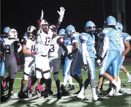  ?? Photo by Ernest A. Brown ?? Woonsocket senior Dwayne Robinson-O’Hagan (11) celebrates a first-quarter touchdown during the Villa Novans 46-8 Division II victory over Johnston Friday night. The Villa Novans are now 3-1 and are virtually assured of a playoff spot.