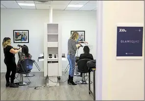  ?? Bloomberg News/VICTOR J. BLUE ?? Late last month, stylists blow-dry hair at a salon offered by the Tishman Speyer Properties LP Zo program and app at Rockefelle­r Center in New York.