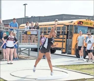  ?? Tim Godbee ?? A Calhoun Middle School girl sends the shot put airborne during the Gordon County championsh­ip last week.