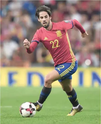 ?? — AFP ?? Spain’s midfielder Isco drives the ball during the World Cup 2018 qualifier against Italy at the Santiago Bernabeu Stadium in Madrid on Saturday.