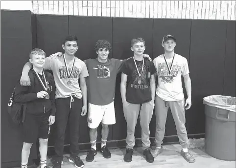  ?? PHOTOS SUBMITTED ?? McDonald County wrestlers with Oklahoma State recruit Daton Fix (facing photo from left to right: Levi Smith, Johann De La Cruz, Daton Fix, Oscar Ortiz, and Christian Willmann)