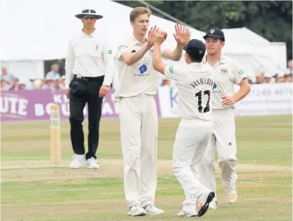  ??  ?? Gloucester­shire’s Craig Miles celebrates with Graeme van Buuren after he had taken the catch (pictured below) to dismiss Sussex’s Luke Wells at Cheltenham Pictures: Rosemary Watts