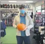  ??  ?? Brennan Wojdyla of Sievert Sporting Goods in Clifton Park, an independen­t small business and Saratoga County Chamber of Commerce member, displays a pumpkin carved with the phrase “Save Our Locals.”