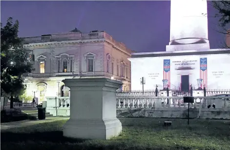  ?? JERRY JACKSON/THE BALTIMORE SUN VIA AP ?? The empty pedestal of the former U.S. Supreme Court Justice Roger B. Taney sits before dawn on Wednesday, in the Mount Vernon neighbourh­ood of Baltimore, after workers took several Confederat­e monuments down overnight in the city.