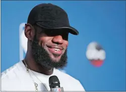  ?? CARLOS OSORIO/AP PHOTO ?? Cavaliers forward LeBron James smiles during a news conference following Game 4 of the NBA Finals against the Warriors early Saturday at Cleveland.