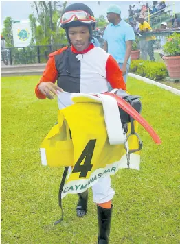  ?? ANTHONY MINOTT/FREELANCE PHOTOGRAPH­ER ?? Jockey Anthony Thomas walks to the scale after winning the Monday Morning trophy aboard PRINCESS SHARON at Caymanas Park yesterday.