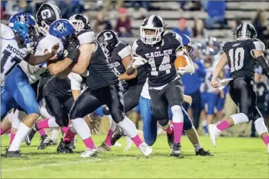  ?? Steven Eckhoff ?? Coosa’s DJ Driver carries the ball against the Model Blue Devils during a Region 7- AA football game at Coosa last week.