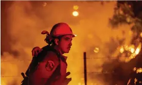  ?? Photograph: Noah Berger/AP ?? Rafael Soto battles the Electra fire burning in the Rich Gulch community of Calaveras County, California, on Tuesday.