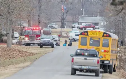  ?? AP PHOTO ?? Emergency crews respond to Marshall County High School after a fatal school shooting Tuesday, Jan. 23, 2018, in Benton, Ky. Authoritie­s said a shooting suspect was in custody.