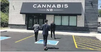  ?? TWITTER.COM/DISCOVEROG­I ?? Cannabis industry officials get a preview tour of the Cannabis NB store, which will be run by a subsidiary of its provincial liquor authority, in Saint John. Cannabis NB so far has 11 stores ready.