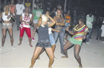  ??  ?? In this file photo patrons are seen enjoying a dancehall session. Dancehall music is a reflection of, or reaction to, scenarios and circumstan­ces in society as the artiste perceives it.