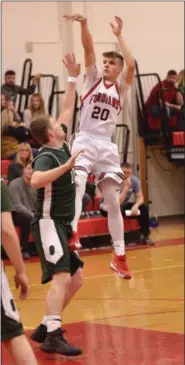  ?? STAN HUDY - THE SARATOGIAN ?? Waterford-Halfmoon’s Michael Talavera leaps up and releases a jump shot Friday night against Greenwich. He would finish with a game-high 20points for the Foridans.