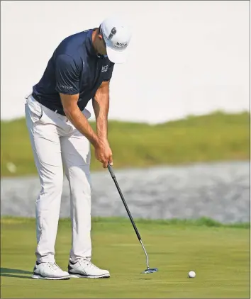  ?? Craig Lassig / Associated Press ?? Cameron Tringale makes his final putt on the 18th hole to take the lead at 12 under par during the third round of the 3M Open in Blaine, Minn., on Saturday.