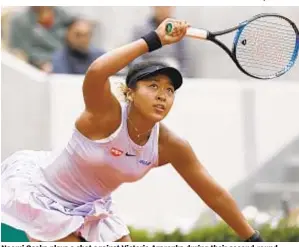  ?? AP ?? Naomi Osaka plays a shot against Victoria Azarenka during their second-round match of the French Open at Roland Garros in Paris on Thursday.