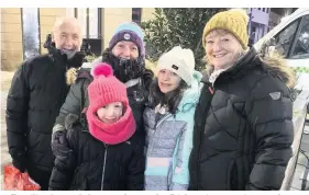  ??  ?? ●●
Families braved the weather at the Dickensian evening market and ice rink in Accrington.