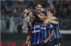  ?? Fiorentina. Photograph: Spada/AP ?? Atalanta's Ademola Lookman (bottom left) celebrates after scoring the only goal of the game against