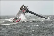  ?? U.S. COAST GUARD COAST GUARD CUTTER GLENN HARRIS VIA AP ?? A Coast Guard Station Grand Isle 45-foot Response BoatMedium heads toward a capsized 175-foot commercial lift boat Tuesday, searching for people in the water 8 miles south of Grand Isle, Louisiana.