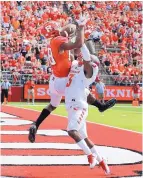  ?? MEL EVANS/ASSOCIATED PRESS ?? Rutgers wide receiver Andre Patton, left, catches a touchdown pass Sept. 17 while being defended by New Mexico’s Nias Martin. The Lobos blew a 21-0 lead in that game.