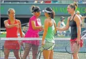  ?? GETTY IMAGES ?? Sania Mirza and Barbora Strycova (left) shake hands with Gabriela Dabrowski (far right) and Yifan Xu after the loss.