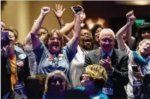  ?? ALYSSA POINTER / ALYSSA.POINTER@AJC.COM ?? Party faithful cheer Saturday during the Democratic Party of Georgia convention at the CNN Omni Hotel in Atlanta. Hundreds of delegates were on hand.