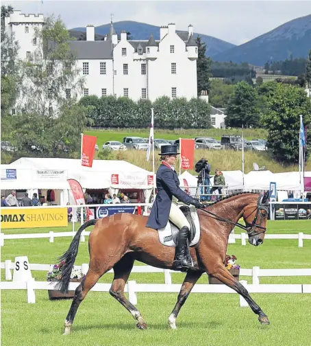  ?? Picture: Julia Shearwood. ?? Polly Stockton performs with her horse in front of Blair Castle.