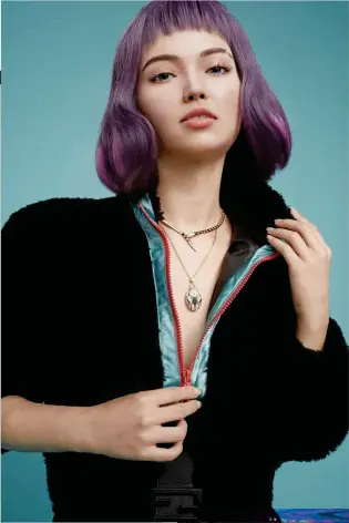  ?? ?? Shearling and silk sweater, Fendi. Serpenti Viper Collier pink gold and diamond necklace, and Serpenti rose gold, sapphire, malachite and diamond necklace, Bvlgari