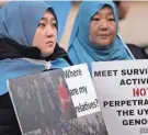  ?? ALASTAIR GRANT/AP FILE ?? A small group in London protests China’s treatment of ethnic Uyghurs in the Xinjiang Uyghur Autonomous Region on Feb. 13.