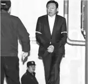  ?? BLOOMBERG ?? Lotte Group Chairman, Shin Dong-bin, walks towards a prison bus at the Seoul Central District Court on Tuesday