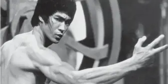  ?? FILE PHOTO ?? Bruce Lee is the subject of one of two new biographie­s that go into unusual depth in plumbing the private lives of unlikely movie stars.