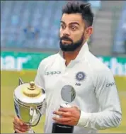  ?? PTI ?? Virat Kohli with the Man of the Match and Series trophies.