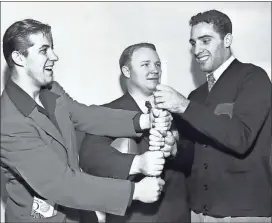  ?? Bettmann archive/Getty images for Georgia athletics ?? After their 9-0 win over the University of California at Low Angeles, these Bulldogs jubilantly clasp hands about part of the goal post. They are (left to right) Georgia’s AllAmerica­n halfback, Frank Sinkwich, who hobbled over the goal line for the game’s sole touchdown; head coach Wally Butts, and halfback Charley Trippi, who carried the ball toward the winning touchdown.