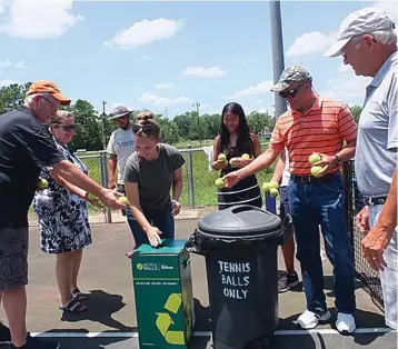  ?? Photo by Neil Abeles ?? ■ Kicking off a tennis ball recycling effort at the Linden City Park Courts by filling one boxare, from left, Gary Clayton, Kendra Clayton, Michael Riley, Allie Anderson, Clare Wong, Paul Wong and Bruce Legrow.